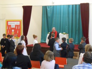 Receiving the Eucharist at our school mass.